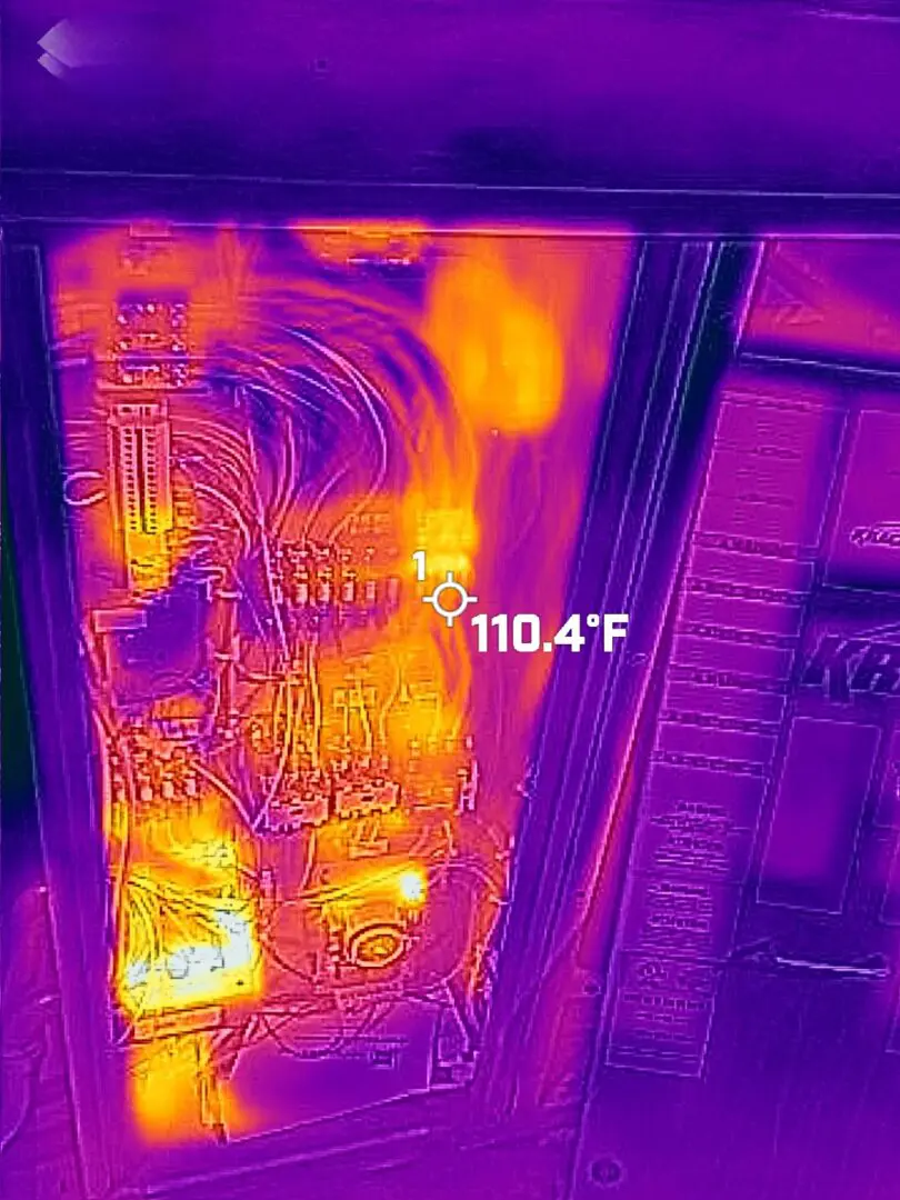 A building with an electrical panel and temperature image.