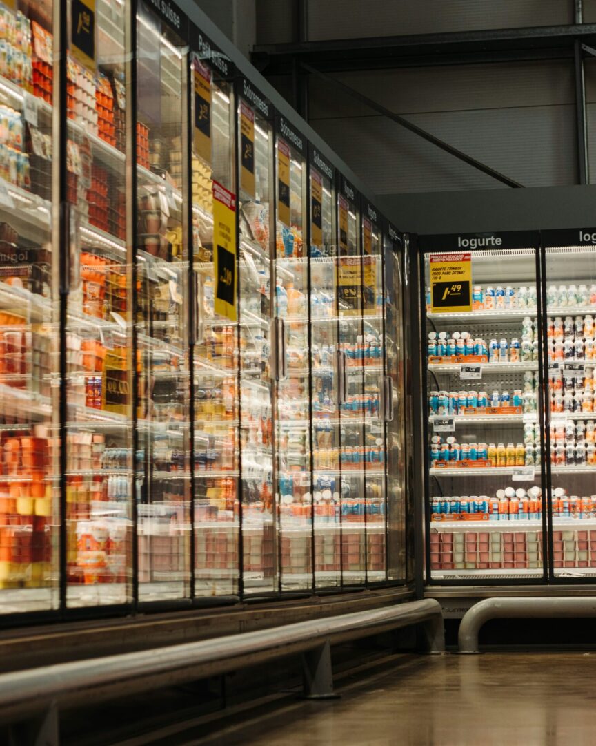 A large display case in a grocery store filled with lots of beverages.